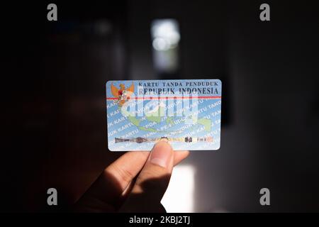 Semarang, Indonesia - November 4, 2022: A hand holds an Indonesian identity card or known as Kartu Tanda Penduduk (KTP). Stock Photo