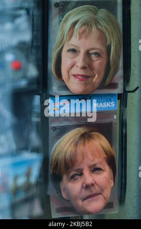 Party masks with images of Theresa May, a former UK Prime Minister and Angela Merkel, the Chancellor of Germany, seen for sale in Central London. On Saturday, 25 January 2020, in London, United Kingdom. (Photo by Artur Widak/NurPhoto) Stock Photo