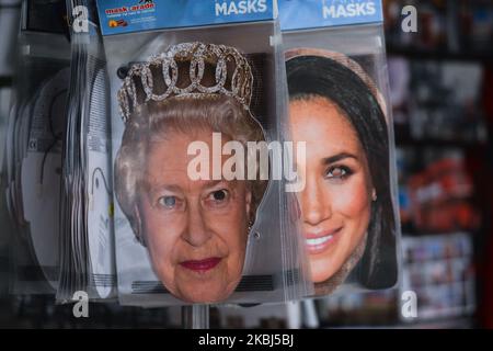 Party masks with images of Queen Elizabeth II and Meghan Markle, seen for sale in Central London. On Saturday, 25 January 2020, in London, United Kingdom. (Photo by Artur Widak/NurPhoto) Stock Photo