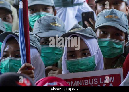 A number of workers who are members of the Trade Union rallied in the Batam city government area, Monday March 2, 2020. They reject the ratification of the Employment Copyright Omnibus Bill because workers claim not to be involved in the deliberation of the bill and its contents are considered to further reduce workers' welfare by eliminating the obligation to pay severance, abolishing the role of trade unions, the easy lay-off of workers and the imposition of wages based only on working hours (Photo by Teguh Prihatna/NurPhoto) Stock Photo