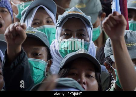 A number of workers who are members of the Trade Union rallied in the Batam city government area, Monday March 2, 2020. They reject the ratification of the Employment Copyright Omnibus Bill because workers claim not to be involved in the deliberation of the bill and its contents are considered to further reduce workers' welfare by eliminating the obligation to pay severance, abolishing the role of trade unions, the easy lay-off of workers and the imposition of wages based only on working hours (Photo by Teguh Prihatna/NurPhoto) Stock Photo