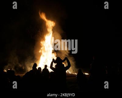 Bulgarians attend and play around a ritual bonfire in the village of Preselci, some 450 kms (280 miles) north-east from the capital Sofia. Bulgarians mark Sirni Zagovezni, an Orthodox Christian holiday during which they chase away evil spirits with bon fire and mask rituals. (Photo by Petar Petrov/Impact Press Group/NurPhoto) Stock Photo