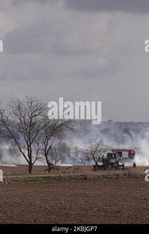 Greek military forces and riot police officers are seen at the through tear gas, close to the Greek-Turkish borderline, in Kastanies, Evros region, on 07 March 2020. For over a week, thousand of migrants and refugees have gathered to the Greek-Turkish borders, after the decision of the Turkish Government to let them have free pass to Europe through Greece. (Photo by Achilleas Chiras/NurPhoto) Stock Photo