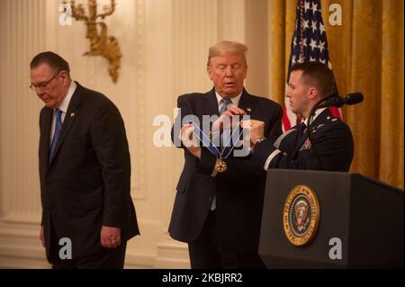 President Donald Trump presents the Presidential Medal of Freedom to retired four-star Army general Jack Keane during a ceremony in the East Room of the White House March 10, 2020 in Washington, DC. Gen. Keane currently works as an analyst on Fox News. (Photo by Zach D Roberts/NurPhoto) Stock Photo