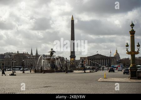 Place of the concorde usually very busy is almost empty in Paris, France, on March 13, 2020. The day after the President 's intervention on Television about Coronavirus,in Paris, there is no traffic on the usual busy streets, busy places,as place de la Concorde,which was almost empty of cars, of people.Parisians are starting to wear face mask,as the tourists do ,in tourist places, on the streets, in subway, even in their car.some Museum are starting to close as the orsay museum, the louvre museum was quiet as ever. (Photo by Jerome Gilles/NurPhoto) Stock Photo