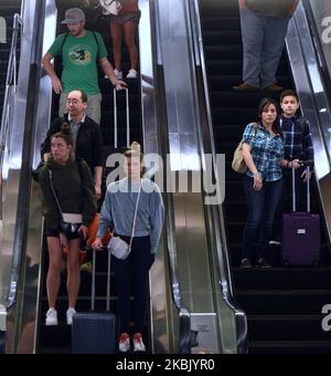 Travelers arrive at Orlando International Airport in Orlando, Florida several hours before the temporary ban on air passengers from Europe ordered by President Trump was set to go into effect at midnight on March 13, 2020, in an effort to curb the spread of the coronavirus (COVID-19) outbreak in the United States. (Photo by Paul Hennessy/NurPhoto) Stock Photo