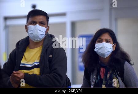 Travelers wearing face masks arrive at Orlando International Airport in Orlando, Florida several hours before the temporary ban on air passengers from Europe ordered by President Trump was set to go into effect at midnight on March 13, 2020, in an effort to curb the spread of the coronavirus (COVID-19) outbreak in the United States. (Photo by Paul Hennessy/NurPhoto) Stock Photo