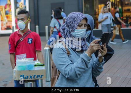 People wearing masks as they took precautionary measures against the spread of Coronavirus COVID-19 in Kuala Lumpur, Malaysia, 14 March 2020. More than 70,000 people have recovered from coronavirus worldwide, nearly half of the total infections recorded since the outbreak began. (Photo by Aizuddin Saad/NurPhoto) Stock Photo