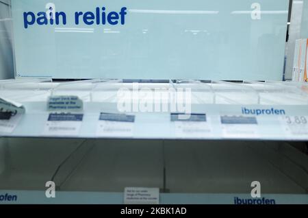 Empty shelves usually stocked with pain relief medication are seen at a branch of Boots chemist in Paddington Station in London, England, on March 14, 2020. Around the country, covid-19 coronavirus fears continue to escalate, with 1,140 UK cases now confirmed and 21 deaths. British Prime Minister Boris Johnson has meanwhile come under pressure for not following other countries in imposing severe restrictions such as school closures or, as is set to happen in Spain from Monday, a lockdown of people in their homes. (Photo by David Cliff/NurPhoto) Stock Photo