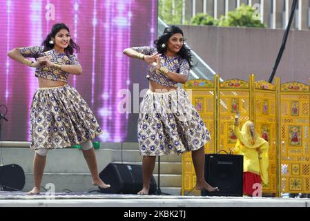 Indian dancers perform a Bollywood dance during the Taste of India food festival at Nathan Philips Square in Toronto, Ontario, Canada, on August 04, 2019. The festival showcased food vendors offering tasty and exotic delicacies and a variety of street food from across India. (Photo by Creative Touch Imaging Ltd./NurPhoto) Stock Photo
