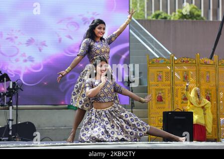 Indian dancers perform a Bollywood dance during the Taste of India food festival at Nathan Philips Square in Toronto, Ontario, Canada, on August 04, 2019. The festival showcased food vendors offering tasty and exotic delicacies and a variety of street food from across India. (Photo by Creative Touch Imaging Ltd./NurPhoto) Stock Photo