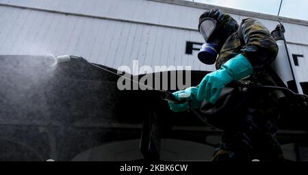 Sri Lankan Air Force officers spray disinfectant liquid at the main railway station at Fort in Colombo, Sri Lanka on March 18, 2020. Sri Lanka have 50 Covid-19 (Corona Virus) positive cases so far according to Sri Lanka's Director General of Health Services, Dr. Anil Jasinghe. Sri Lankan Police Spokesman said that the Sri Lankan government decided to impose police curfew in the Puttalam District and Kochchikade Police Division in Negombo on 18 March 2020 to curb the spread of Covid-19 virus. (Photo by Tharaka Basnayaka/NurPhoto) Stock Photo