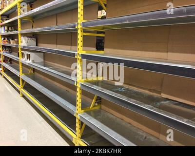 Empty shelf that contained flour and rice at a grocery store as panic buying and hoarding of food and sanitary items continues due to fear of the novel coronavirus (COVID-19) across the country on March 17, 2020 in Toronto, Ontario, Canada. Canadians emptied shelves of grocery stores and markets to stockpile supplies such as toilet paper and canned goods. In many stores have begun rationing items and limiting the amount of people allowed to enter the store. The World Health Organization has declared COVID-19 a global pandemic. (Photo by Creative Touch Imaging Ltd./NurPhoto) Stock Photo