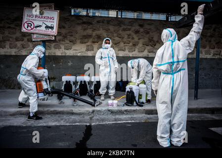 Workers in hazmat suits prepare the disinfectants in San Juan City, Philippines on March 19, 2020 where 20 confirmed cases of COVID-19 is recorded. The island of Luzon including Metro Manila is placed under an 'enhanced community quarantine’ in an effort to curb the spread of COVID-19. Classes, work, and mass transport are suspended on the entire island with some exemptions. The Philippines has recorded 217 cases of COVID-19, 17 deaths, and 8 recoveries.(Photo by Lisa Marie David/NurPhoto) Stock Photo