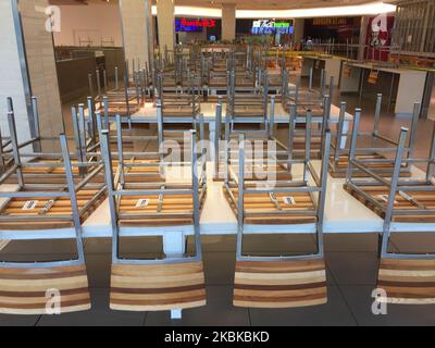 Chairs seen in an empty food court in a shopping mall in Toronto, Ontario, Canada on March 21, 2020. Restaurants have been prohibited from allowing dine-in service and food courts and cafeterias have been ordered to be closed by the Province of Ontario, with any deciding to remain open facing steep fines and penalties. Retailers in malls across Canada have shuttered their stores due to the novel coronavirus (COVID-19) outbreak. Many malls are limiting entry to only 50 visitors at a time. (Photo by Creative Touch Imaging Ltd./NurPhoto) Stock Photo