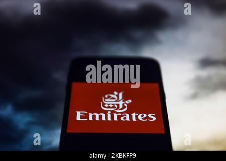 Emirates app icon is seen on the smartphone screen in this illustration photo taken in Poland on March 24, 2020. (Photo illustration by Jakub Porzycki/NurPhoto) Stock Photo