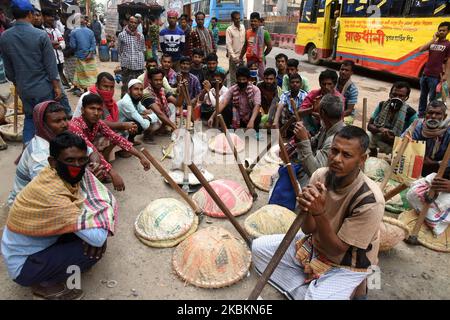 A group of unskilled day laborers wait to be hired by employers. There are scores of such ''labor markets'' in the Bangladeshi capital, in Dhaka, Bangladesh, on March 24, 2020. (Photo by Mamunur Rashid/NurPhoto) Stock Photo