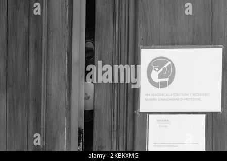(EDITOR'S NOTE: Image was coverted to black and white) Doctors enter the Soldiers' Home of Mela in Naples, on April 2, 2020. State and local officials did not learn until the weekend that a coronavirus outbreak at Home of Mela that has now killed 2 senior had taken a deadly turn. Twenty-six of the residents who have tested positive for COVID-19 (Photo by Paolo Manzo/NurPhoto) Stock Photo