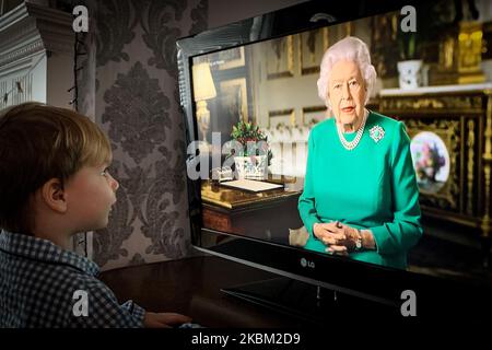 Photographer's son, watches from home as Queen Elizabeth II addresses the nation in a special broadcast to the United Kingdom and the Commonwealth in relation to the coronavirus outbreak on April 05, 2020. (Photo by Robin Pope/NurPhoto) Stock Photo