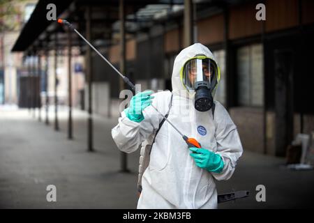 Toulouse has begun to disinfect its streets and urban furniture to stem the propagation of the coronavirus SRAS-COV-2, responsible of the Covid-19 disease. Cleaning worker use diluted bleach to spay. They wear protectice suits and gloves and a face mask. More than 180 places will be disinfected in the next few days. In France, to date, the SARS-COV-2 virus has killed more than 8000 people. Toulouse. France. April 7th 2020. (Photo by Alain Pitton/NurPhoto) Stock Photo