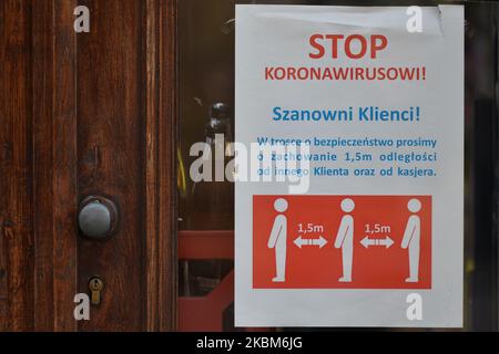 A notice in relation to social distancing measures in a shop in Krakow's center. On Wednesday, April 8, 2020, in Krakow, Poland. (Photo by Artur Widak/NurPhoto) Stock Photo