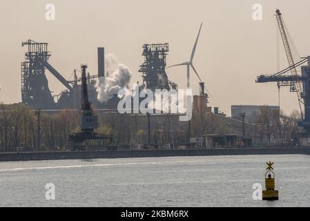 General view of ArcelorMittal in the port of Ghent, Belgium on April 09, 2020. ArcelorMittal group cuts the production in Europe due to the corona crisis (COVID-19) ArcelorMittal is the world's largest steel producer, Lakshmi Mittal (owner of Mittal Steel) is the chairman and CEO, The company will mainly produce less flat steel. This type of steel is often supplied to automakers, but they shut down their factories in Europe because of the corona virus. Lakshmi N Mittal Assistance relief in Emergency situation in India to stop the coronavirus. (Photo by Jonathan Raa/NurPhoto) Stock Photo