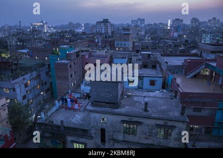 Bangladeshi Muslims pray their prayer on the rooftop of a building during government-imposed lockdown as a preventive measure against the COVID-19 coronavirus in Dhaka, Bangladesh on April 10, 2020. (Photo by Zakir Hossain Chowdhury/NurPhoto) Stock Photo