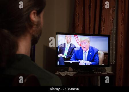 Trump Address Video A person watches as President Donald Trump speaks at a campaign rally ...