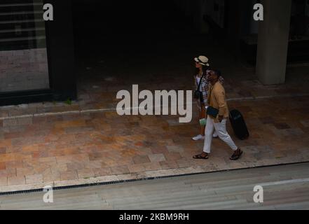 A nice couple was having a great time in the city, now they are about to go in the next one Stock Photo