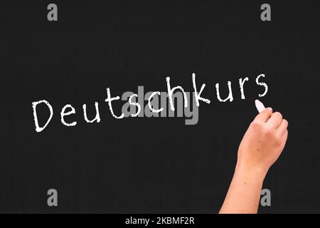the word german course on a blackboard Stock Photo