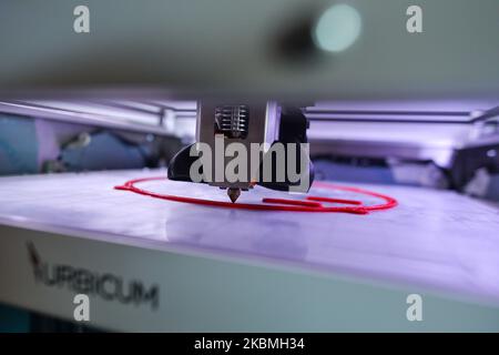 A 3D printer makes partes of the VentilAid Prototype III respirator, a device that can be manufactured cheaply and with widely available parts using a 3D printer. The project was created by Urbicum, a Krakow based company specializing in 3D printing. The first two versions were developed and made available for free on the Internet. VentilAid Prototype III is a device for non-invasive ventilation, operating in CEPAP and BiPAP mode with an oxygen supply and meets the requirements of modern medical standards. It allows to keep patients in a stable condition and/or improve the condition of a consc Stock Photo