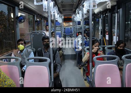 People are seen wearing masks inside a Delhi Transport Corporation (DTC) bus as a preventive measure against Covide-19 ahead of 'Janta Curfew' in New Delhi on March 21, 2020. India is observing a 14 hour ''Janta Curfew'' called by Prime Minister Naredra Modi in order to contain the corona virus outbreak in India. (Photo by Mayank Makhija/NurPhoto) Stock Photo