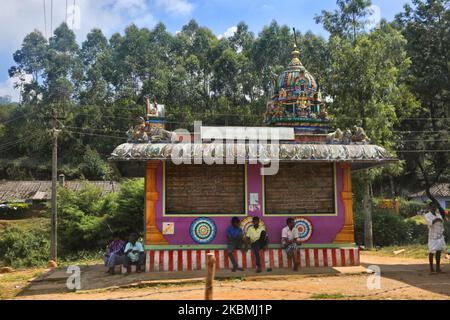 People relax by a small Hindu temple in Madupetty, Idukki, Kerala, India on February 17, 2019. (Photo by Creative Touch Imaging Ltd./NurPhoto) Stock Photo