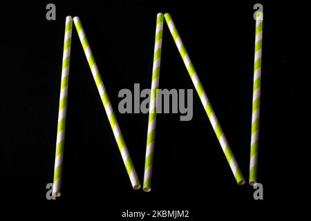 photo multicolored cocktail straws on a black background Stock Photo