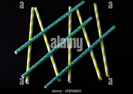 photo multicolored cocktail straws on a black background Stock Photo