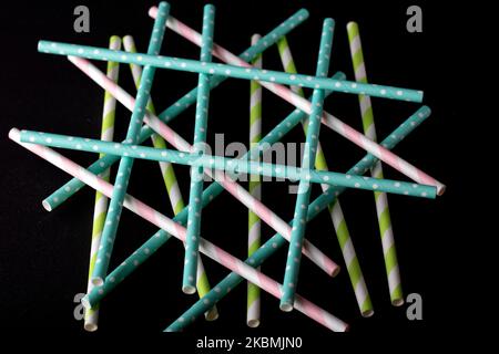 photo multicolored cocktail straws on a black background Stock Photo