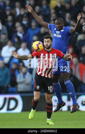 Souleymane Bamba of Cardiff City contests a header with Southampton's Charlie Austin during the Premier League match between Cardiff City and Southampton at the Cardiff City Stadium, Cardiff on Saturday 8th December 2018. (Photo by Mark Fletcher/MI News/NurPhoto) Stock Photo