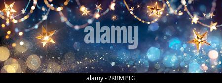 String Star Lights In Blue Defocused Abstract Background With Glittering And Bokeh Stock Photo