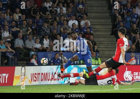 Wesley Hoedt and Maya Yoshida of Southampton attempt to prevent a shot from Leicester City's Kelechi Iheanacho during the Premier League match between Leicester City and Southampton at the King Power Stadium, Leicester on Thursday 19th April 2018. (Photo by Mark Fletcher/MI News/NurPhoto) Stock Photo