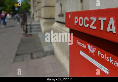 A view of a typical red postal box in Poland. On 22 April, the Ministry of Digital Affairs provided the Polish Post with the PESEL register data needed to prepare the postal vote for the presidential election in May. However, the electoral register is still needed, but many local governments refused to release this data to the Polish Post. On Monday, April 27, 2020, in Krakow, Poland. (Photo by Artur Widak/NurPhoto) Stock Photo