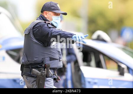 Police checkpoint during COVID-19 pandemic in Italy on April 28, 2020 in Carpi, Italy. (Photo by Emmanuele Ciancaglini/NurPhoto) Stock Photo