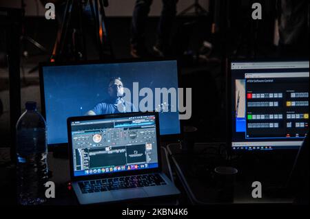 Deyan Stoev rehearses before live streaming. Musicians are organizing secret concerts on balconies in Varna, Bulgaria every Thursday. The musicians self-organized and choose different balconies of apartament buildings around the city to lift the spirits of the neighborhoods during quarantine. They also live stream them on the social medias for the people, Varna, Bulgaria on April 30, 2020 (Photo by Hristo Rusev/NurPhoto) Stock Photo