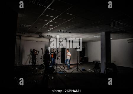 Deyan Stoev rehearses before live streaming. Musicians are organizing secret concerts on balconies in Varna, Bulgaria every Thursday. The musicians self-organized and choose different balconies of apartament buildings around the city to lift the spirits of the neighborhoods during quarantine. They also live stream them on the social medias for the people, Varna, Bulgaria on April 30, 2020 (Photo by Hristo Rusev/NurPhoto) Stock Photo