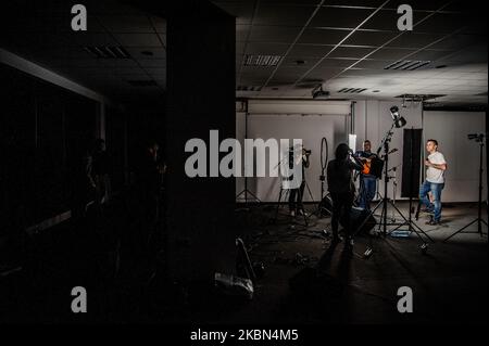 Deyan Stoev rehearses before live streaming. Musicians are organizing secret concerts on balconies in Varna, Bulgaria every Thursday. The musicians self-organized and choose different balconies of apartament buildings around the city to lift the spirits of the neighborhoods during quarantine. They also live stream them on the social medias for the people, Varna, Bulgaria on April 30, 2020 (Photo by Hristo Rusev/NurPhoto) Stock Photo