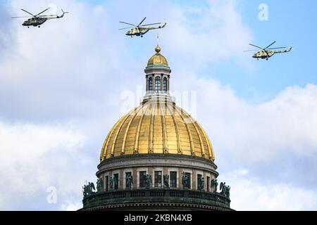Helicopters of the armed forces of the Russian Federation fly over St. Isaac's Cathedral during the rehearsal of the air part of the victory parade, which is celebrated on may 9, in Saint Petersburg, Russia, on April 30, 2020. Due to the coronavirus pandemic, the victory parade will be held without the participation of ground troops. Saint Petersburg, Russia. April 30, 2020 (Photo by Valya Egorshin/NurPhoto) Stock Photo