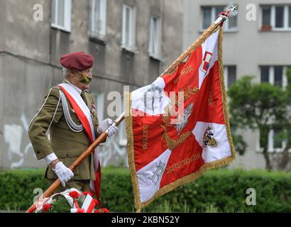 Major Jan Stachow (born in 1929), a former soldier and still active amateur athlete, seen with a banner at Daszynski Avenue to celebrate May Day outside the Monument to the Military Actions of the Proletariat in Krakow. On Friday, May 1, 2020, in Krakow, Poland. (Photo by Artur Widak/NurPhoto) Stock Photo