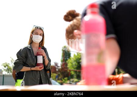 A Factory in Correggio donates alcohol bottles to be distributed by Red Cross and Civil Protection during COVID-19 pandemic in Italy on May 2, 2020 in Correggio, Italy. (Photo by Emmanuele Ciancaglini/NurPhoto) Stock Photo