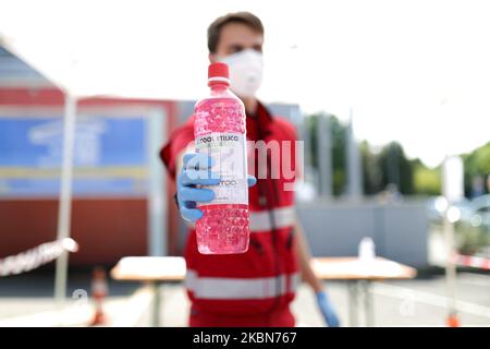 A Factory in Correggio donates alcohol bottles to be distributed by Red Cross and Civil Protection during COVID-19 pandemic in Italy on May 2, 2020 in Correggio, Italy. (Photo by Emmanuele Ciancaglini/NurPhoto) Stock Photo