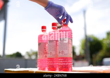 A Factory in Correggio donates alcohol bottles to be distributed by Red Cross and Civil Protection during COVID-19 pandemic in Italy on May 2, 2020 in Correggio, Italy. (Photo by Emmanuele Ciancaglini/NurPhoto) Stock Photo