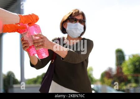 A Factory in Correggio donates alcohol bottles to be distributed by Red Cross and Civil Protection during COVID-19 pandemic in Italy on May 2, 2020 in Correggio, Italy. (Photo by Emmanuele Ciancaglini/NurPhoto) Stock Photo